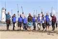 Life’s a beach for lottery winners in charity clean-up