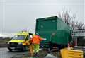 Lorry crashes into bush at busy motorway junction