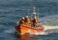 Woman scrambles up cliffs to avoid rising tide