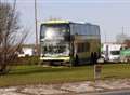 Coach crashes onto roundabout