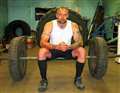 Body builder in strongman test