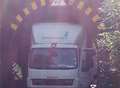 Lorry stuck under low bridge