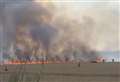 Firefighters battle wall of flames in field blaze