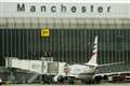 Two men charged with assaulting police after Manchester Airport incident