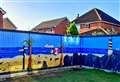 Quirky murals painted on fence panels