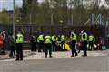 Police attempt to remove climate activists blocking nuclear base