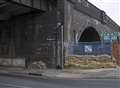 Fire in archway under railway bridge