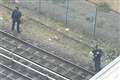 Arrest made and knife seized after person runs onto train tracks in east London