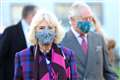 Charles and Camilla learn about vaccine trials during hospital visit