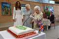 Queen uses ceremonial sword to cut cake during Eden Project engagement