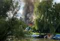 Buildings and boat catch fire in four-hour blaze