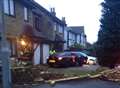 Luxury car ploughs through wall