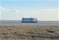 Large unmanned ship drifting towards coast