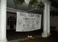 Police called in over Town Hall protest banner