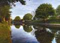 Man and dog rescued after falling down riverbank 