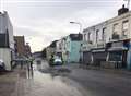 Burst water main floods high street