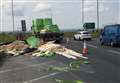Lorry sheds load at busy roundabout