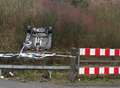 Car leaves road and flips onto roof