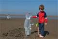 Ice sculptures installed on beach to highlight climate change