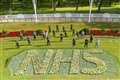 Flowerbeds outside Buckingham Palace replanted with NHS tribute