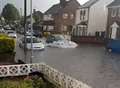 Car stranded as road floods 