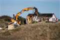 Rock defences being built to slow coastal erosion after homes demolished