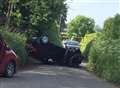 Car overturns in village