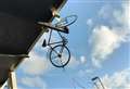 Stolen bike found dangling from railway station bridge