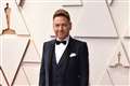 Sir Kenneth Branagh makes red carpet return at star-studded Oscar ceremony