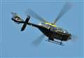 Police helicopter hovers over town