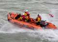 Adults and child in sea rescue