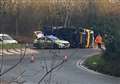 A-road shut as gritter lorry overturns on roundabout