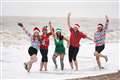 In Pictures: Swimmers take the plunge for bracing Christmas Day dip