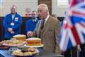 King meets refugees on visit to food bank