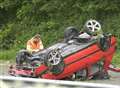 Driver hurt as car overturns on A2