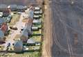 Aerial pictures show devastating impact of field fire just metres from new-build homes