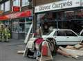 Narrow escape as car smashes into shop front