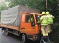 Lorry driver trapped after crashing into wall