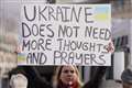 Protesters gather in London to brand Putin a ‘delusional lunatic’ and ‘bully’