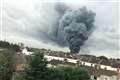 Huge plume of smoke rises above major fire at industrial site