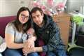 Premature baby born smaller than a human hand returns home