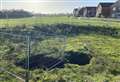 Large sinkhole opens up on estate