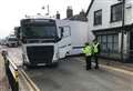 Police help dig red-faced lorry driver out of trouble