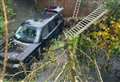 Driver escapes serious injury as Range Rover plunges into river