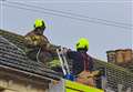 Firefighters pictured tackling roof blaze
