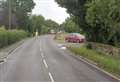 Major road shut after car hits wall and overturns