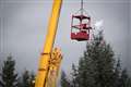 Santa Claus decorates Stirling safari park Christmas tree with help of a crane