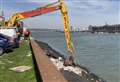 Digger in race against tide to clear rubbish