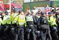 Six charged after migrant protests