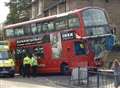 Driver trapped as bus smashes into wall